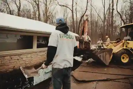 McCoy Contractors foundation repair team working outside with loader Milwaukee