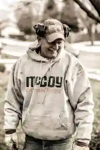 McCoy Contractors foreman working outside and smiling during foundation repair work Milwaukee