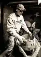 McCoy Contractors, Inc. - Foreman mixing concrete for drain tile repair