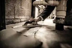 McCoy Contractors, Inc. - Trowel close up of new concrete